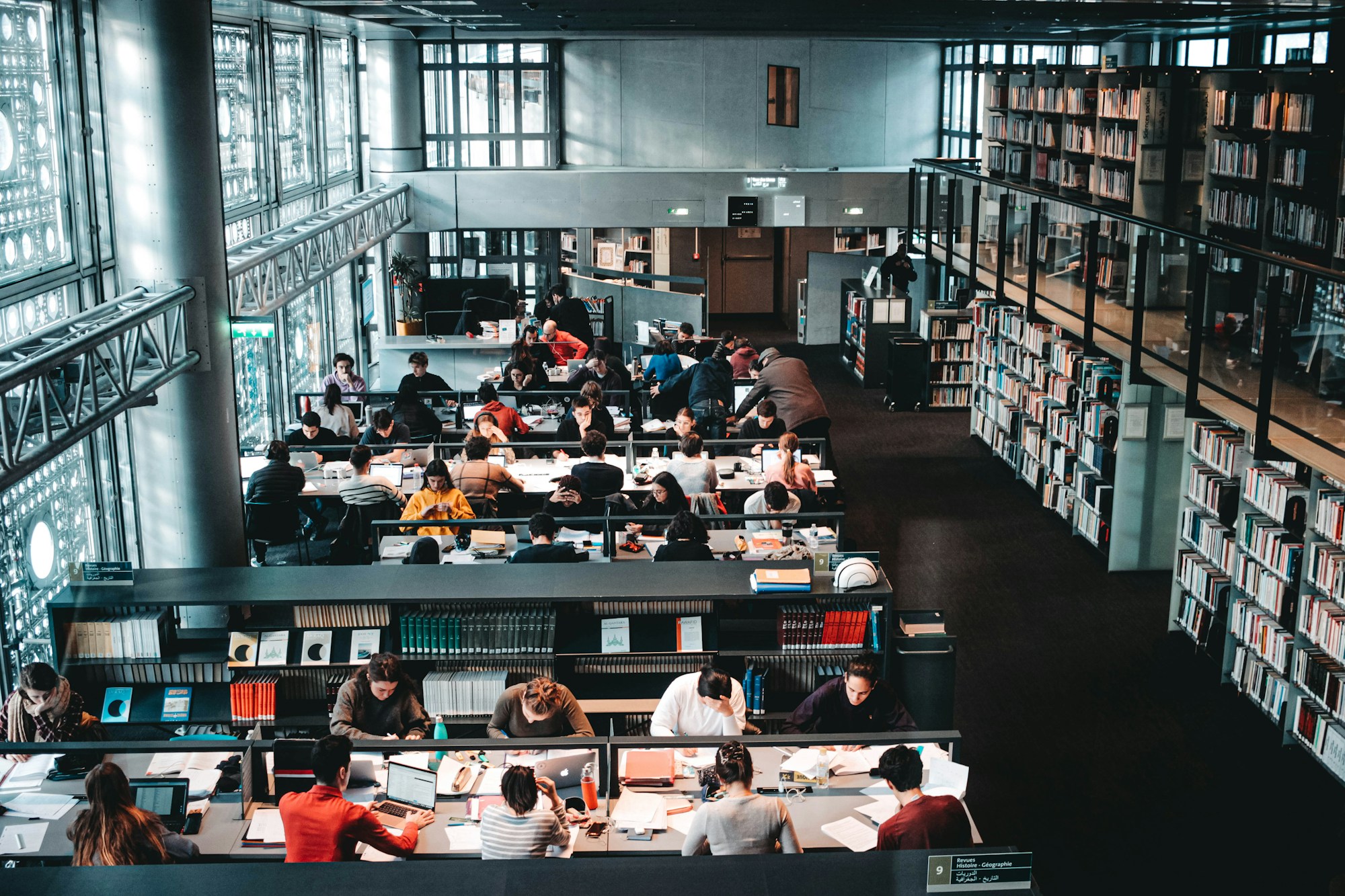 Students studying in a large university library